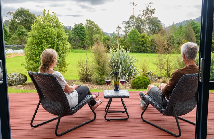 In the cottage, large windows let in as much daylight as possible and ranch slider doors open out to the deck.