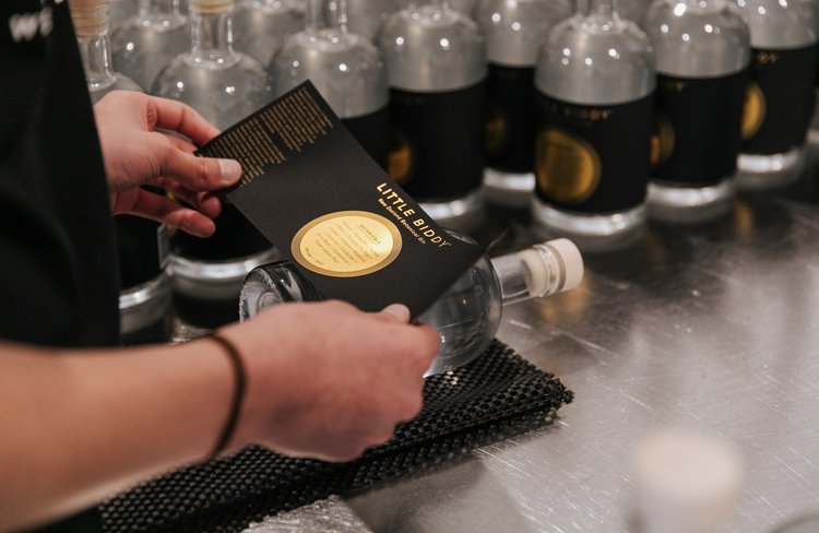 Hand labelling Little Biddy Gin - Classic
