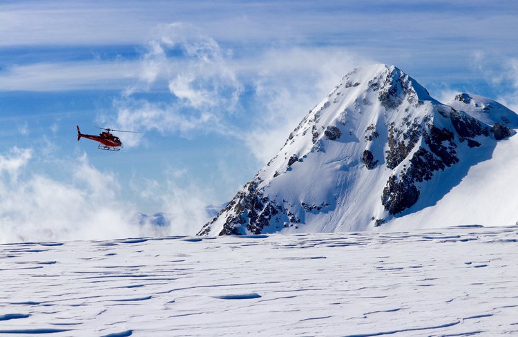 Precision Helicopters Hokitika above snow fields and glaciers in the Southern Alps.