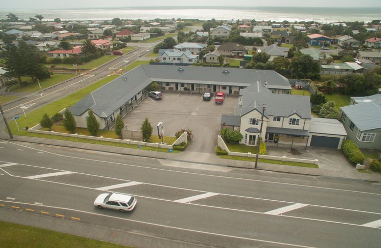 Aerial view of complex. Close to beach.