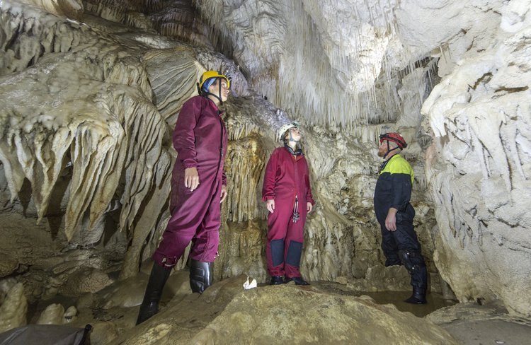 Admiring deep below white calcite wonders after a thrilling journey