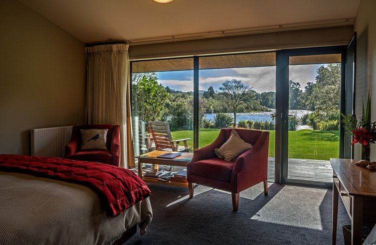 Experience stylish wilderness accommodation alongside the Moeraki River Rapids.