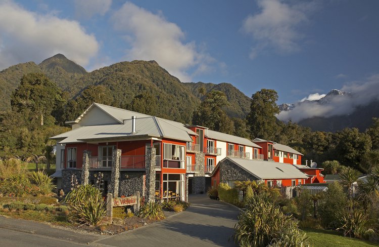 Distinction Fox Glacier nestled beneath the towering Southern Alps