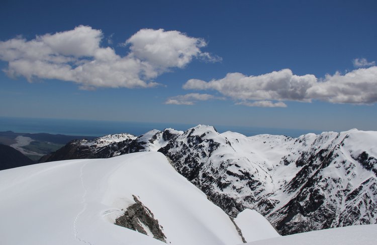 Views west to the Tasman Sea from the top on Chancellor Dome in spring
