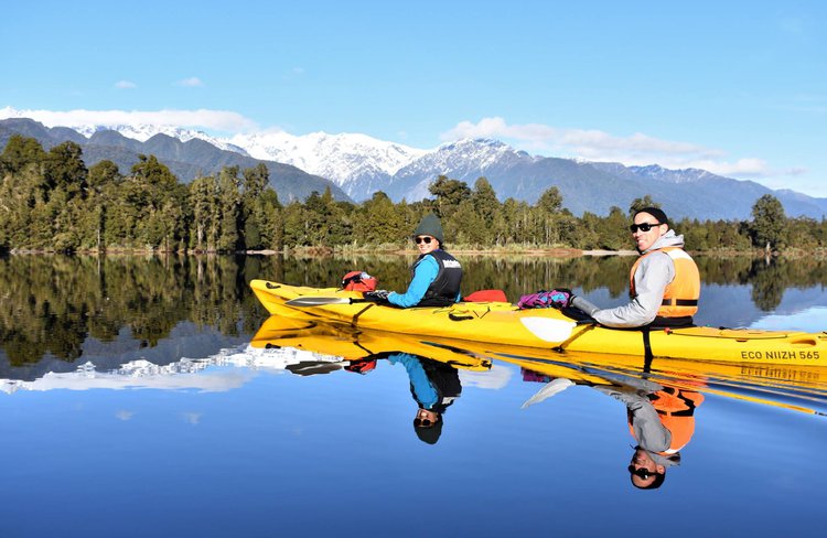 Paddle with us on a mirror lake, with glacier views.