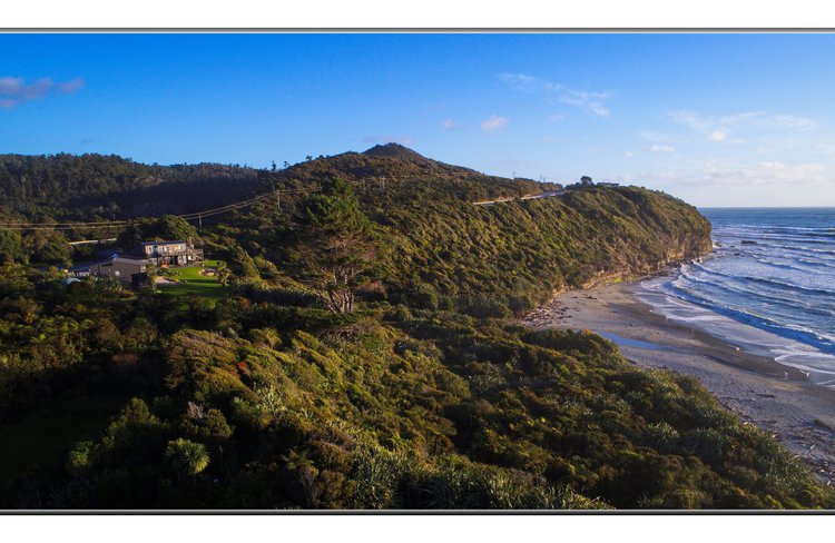 Breakers from the air with view overlooking Tasman Sea