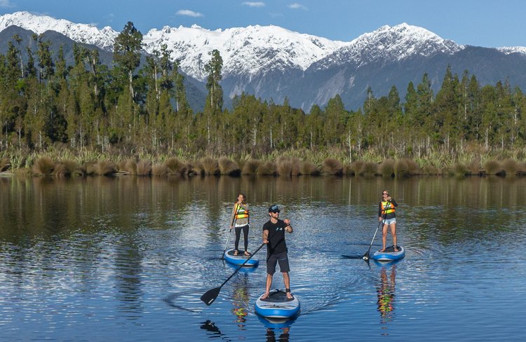 Stand-up Paddleboard on Lake Mapourika.