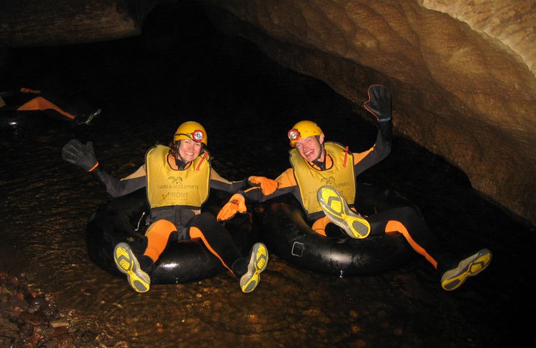 On your tubes and ready to raft through the Glowworm Caves in the Metro Cave near Charleston on the West Coast.